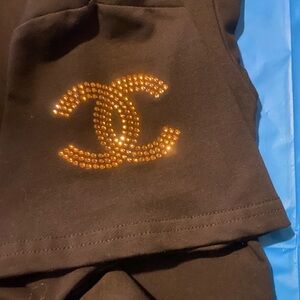 CHANEL Black Tee dress with Gold Embellished Logo